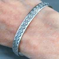 The Silver Mesas quarter-inch wide sterling silver cuff bracelet-Scallop Rope design.  Native American made in the USA.